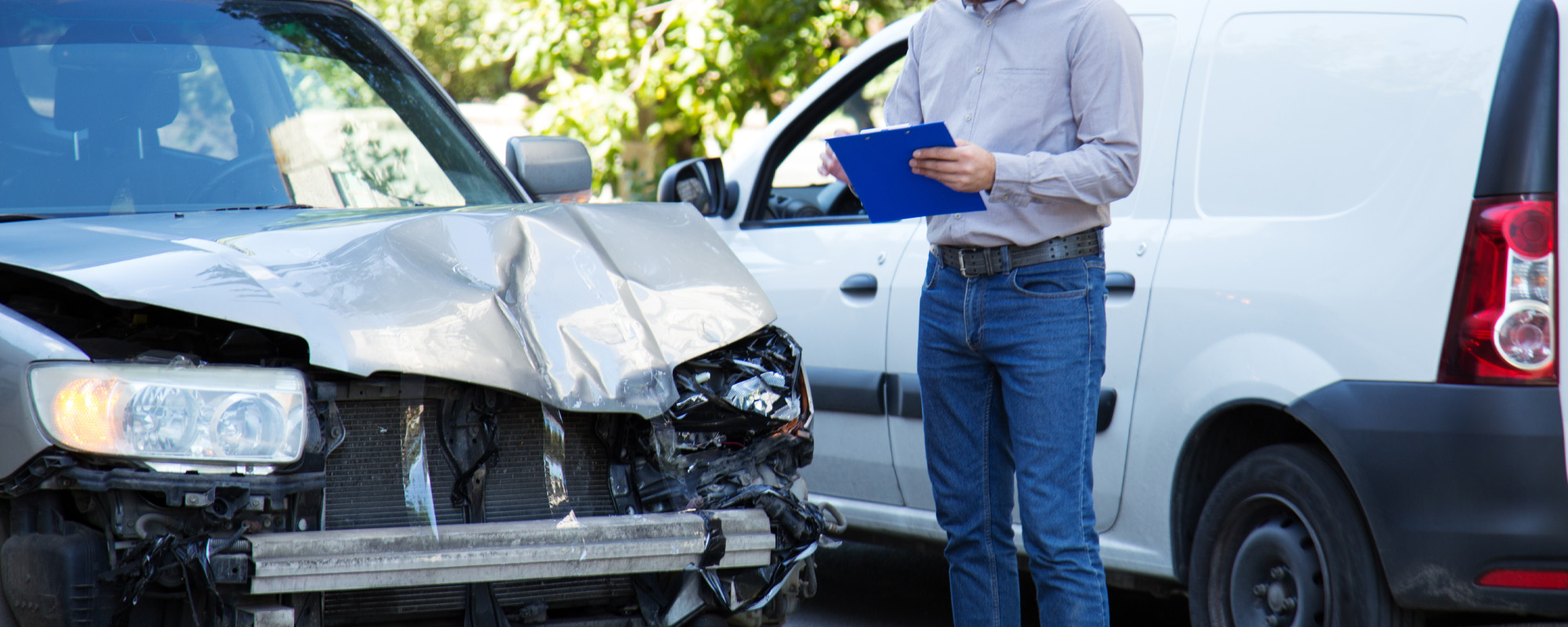 Man insurance agent against destroyed car